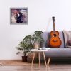 Minimalistic interior design concept. Acoustic guitar on grey textile sofa in spacious room of loft style apartment with wood textured laminated flooring. Background, copy space, close up.