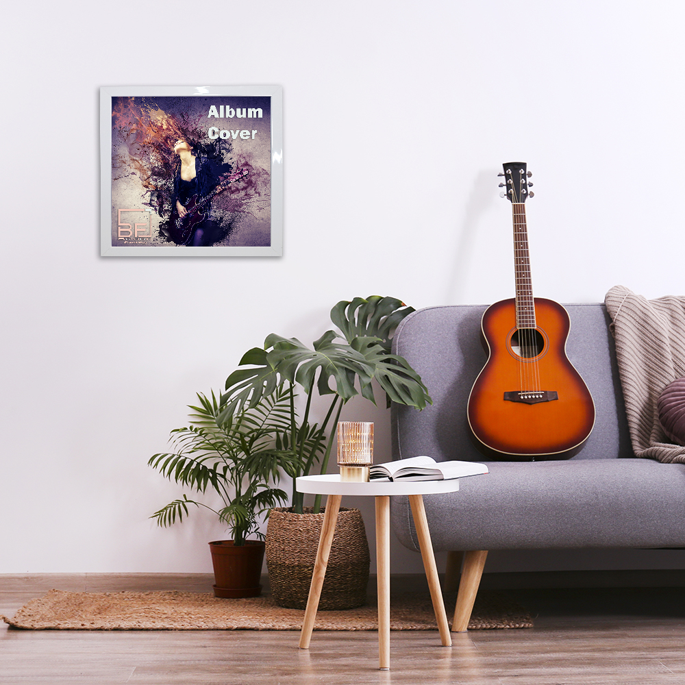 Minimalistic interior design concept. Acoustic guitar on grey textile sofa in spacious room of loft style apartment with wood textured laminated flooring. Background, copy space, close up.