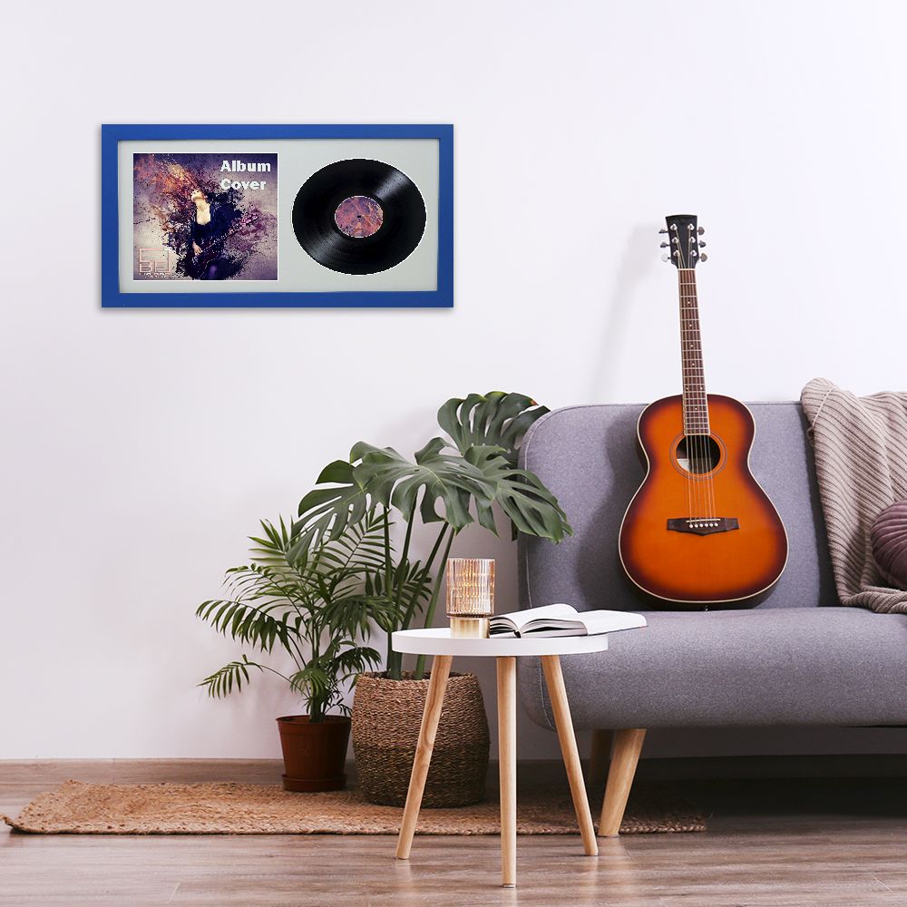 Minimalistic interior design concept. Acoustic guitar on grey textile sofa in spacious room of loft style apartment with wood textured laminated flooring. Background, copy space, close up.