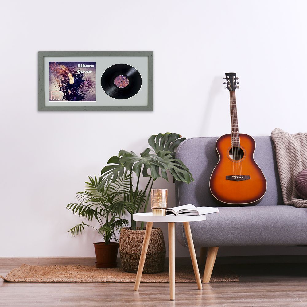 Minimalistic interior design concept. Acoustic guitar on grey textile sofa in spacious room of loft style apartment with wood textured laminated flooring. Background, copy space, close up.