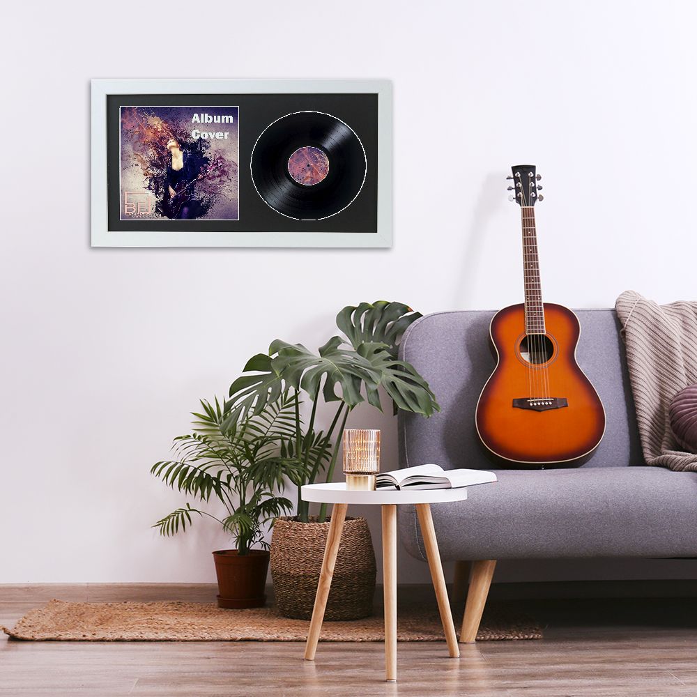 Minimalistic interior design concept. Acoustic guitar on grey textile sofa in spacious room of loft style apartment with wood textured laminated flooring. Background, copy space, close up.