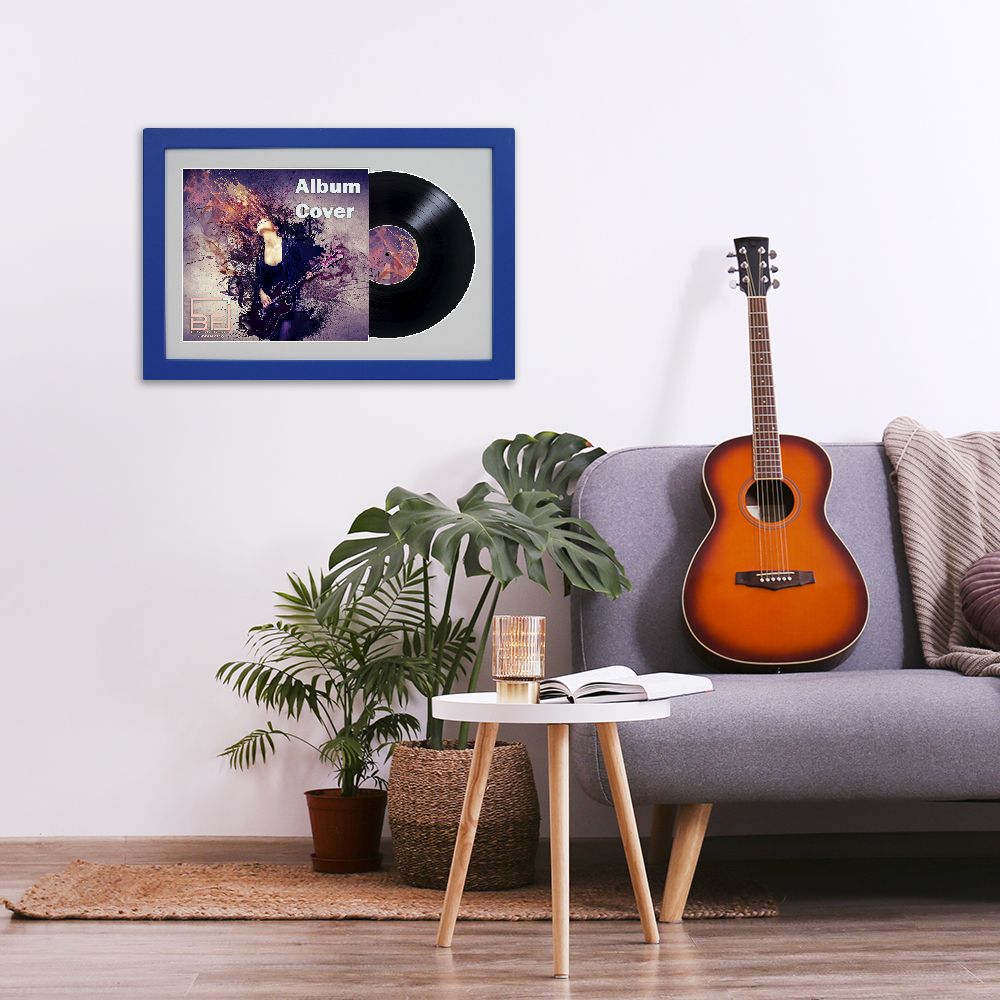 Minimalistic interior design concept. Acoustic guitar on grey textile sofa in spacious room of loft style apartment with wood textured laminated flooring. Background, copy space, close up.
