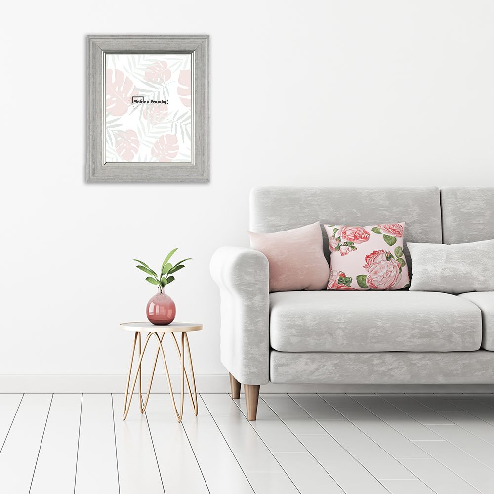 Interior wall mock up with gray sofa, pink pillows and plant in vase in living room with empty white wall. 3D rendering.