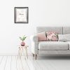 Interior wall mock up with gray sofa, pink pillows and plant in vase in living room with empty white wall. 3D rendering.