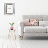 Interior wall mock up with gray sofa, pink pillows and plant in vase in living room with empty white wall. 3D rendering.