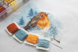 Colourful cross stitch of a bird